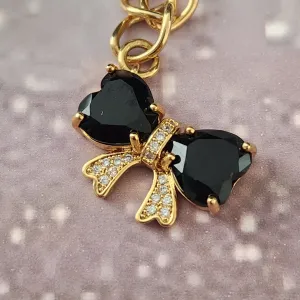 PULSEIRA DOURADA  LAÇO CRAVEJADO MICROZIRCÔNIAS CRISTAL E ZIRCÔNIA NEGRA