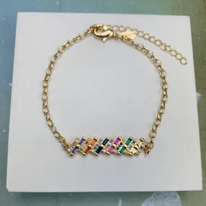 PULSEIRA DOURADA ZIRCÔNIAS NAVETE MULTICOLORIDAS DETALHE MICROZIRCÔNIAS CRISTAL