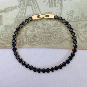 PULSEIRA DOURADA CRAVEJADA EM ZIRCÔNIAS NEGRAS