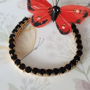 PULSEIRA DOURADA ZIRCÔNIAS REDONDAS NEGRA