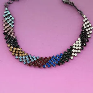 PULSEIRA RÓDIO NEGRO CRAVEJADA ZIRCÔNIAS MULTICOLORIDAS