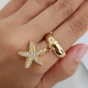 ANEL DOURADO PINGENTE ESTRELA DO MAR CRAVEJADO MICROZIRCÔNIAS CRISTAL