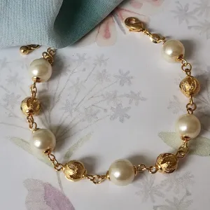 PULSEIRA BOLINHAS DOURADA VAZADA E PÉROLA