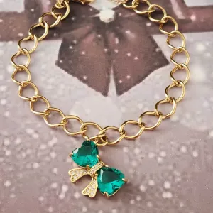 PULSEIRA DOURADA  LAÇO CRAVEJADO MICROZIRCÔNIAS CRISTAL E ZIRCÔNIA ESMERALDA