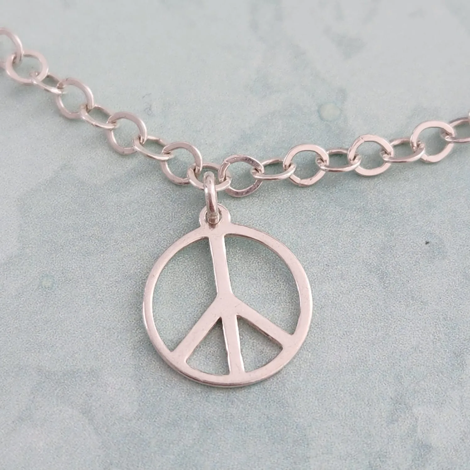 PULSEIRA PRATA 925 PINGENTE SIMBOLO PAZ E AMOR