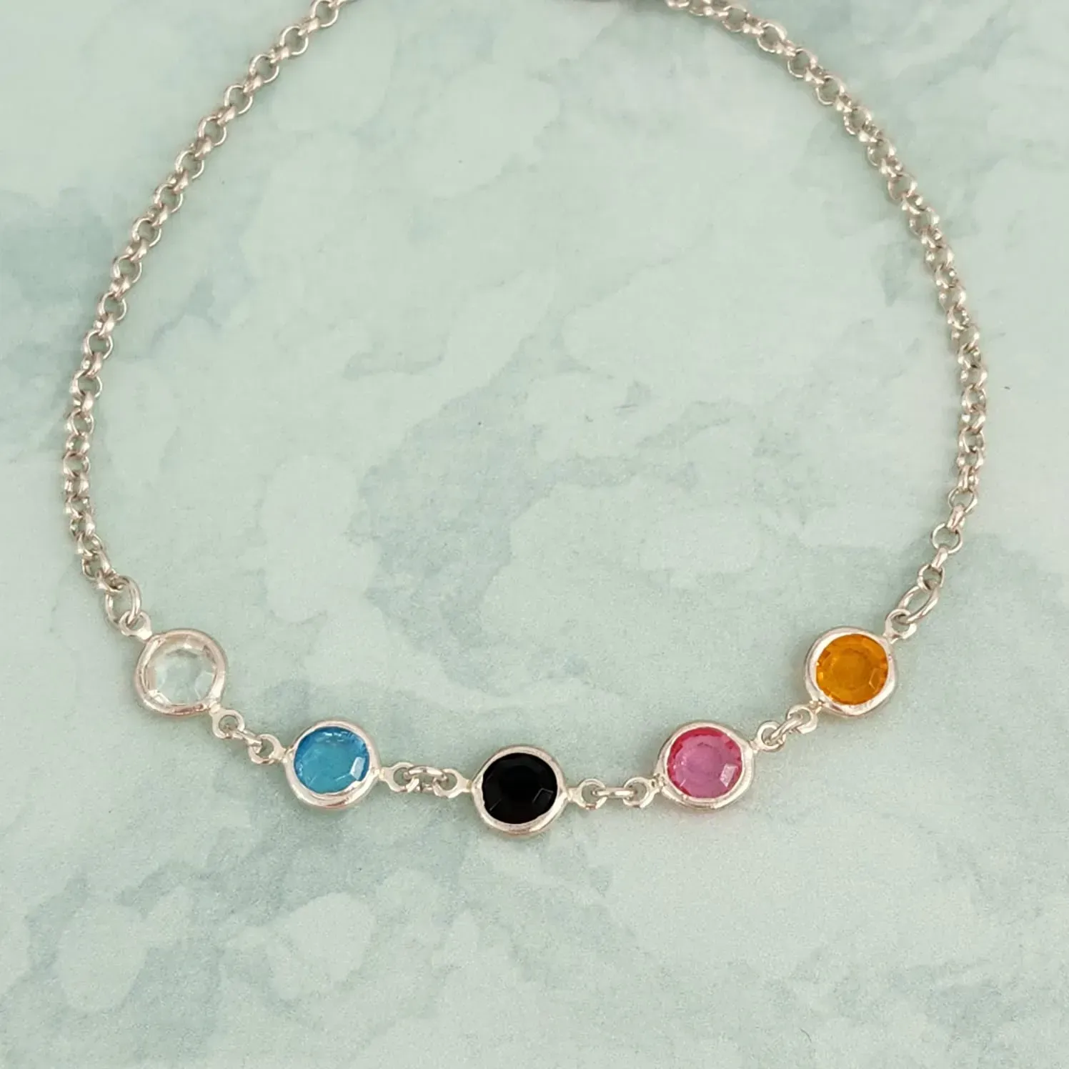 PULSEIRA RÓDIO BRANCO ZIRCÔNIAS MULTICOLORIDAS