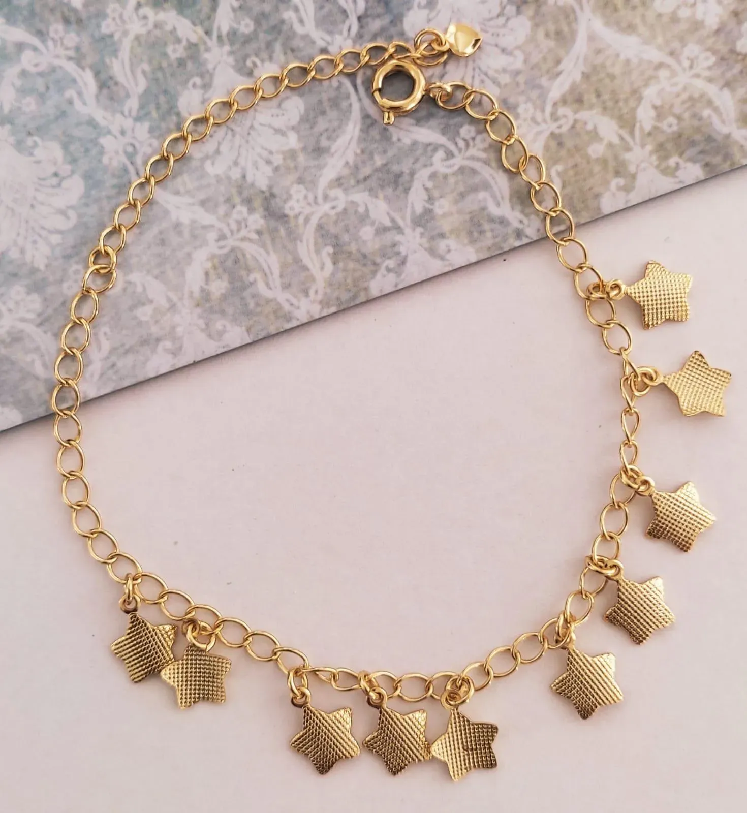 PULSEIRA DOURADA ESTRELAS TRABALHADA